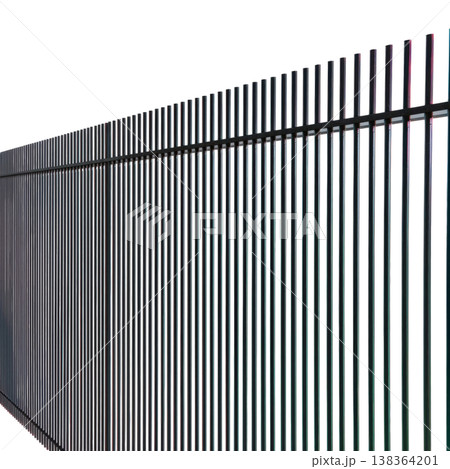 Vertical Black Metal Fence Panels Line a Clear Background in a Minimal Style Setting 138364201