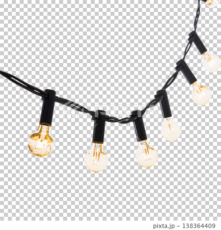String Lights Hang Above a White Background Creating a Warm Glow in a Casual Setting During Evening Hours 138364409