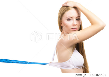 Woman wearing too big bra, loose band Woman wearing too big bra, loose band 138364595