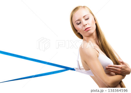 Woman wearing too big bra, loose band Woman wearing too big bra, loose band 138364596