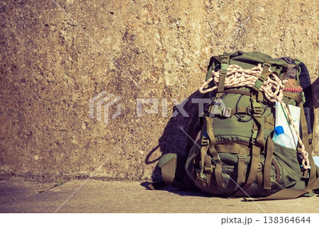 Hiking backpack camping equipment outdoor on grunge wall Hiking backpack camping equipment outdoor on grunge wall 138364644