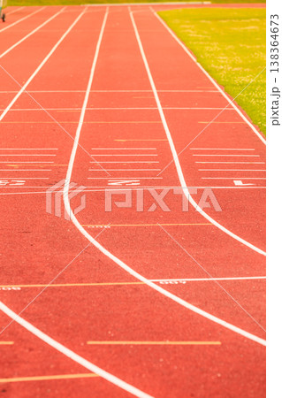 Red running track in stadium. Red running track in stadium. 138364673