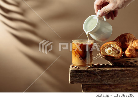 Coffee latte with croissants on an old wooden table. 138365206