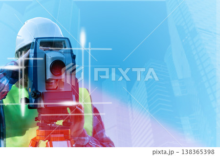 The engineer used theodolite equipment while working on the construction site to survey the route for building a bridge across the intersection. This was done in order to reduce traffic congestion 138365398