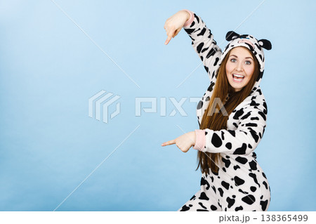 Woman wearing pajamas cartoon pointing down Woman wearing pajamas cartoon pointing down 138365499