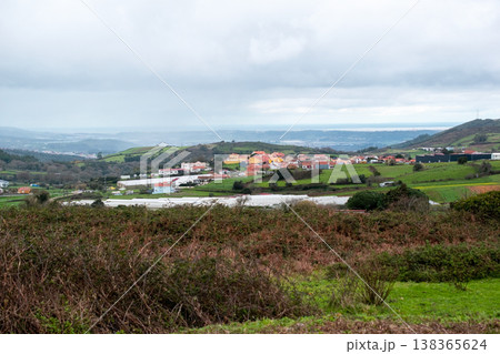 Countryside Agricultural Landscape with Dark Cloudy Sky 138365624