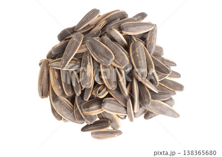 Sunflower seeds pile isolated on white background Sunflower seeds pile isolated on white background 138365680
