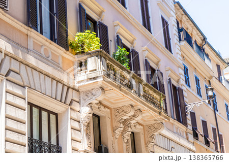 Italy Rome balcony street house facade. Old historical building architecture in the city center. Italian window shutters Italy Rome balcony street house facade. Old historical building architecture in the city center. Italian window shutters 138365766