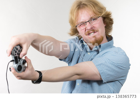 Gamer man holding gaming pad 138365773