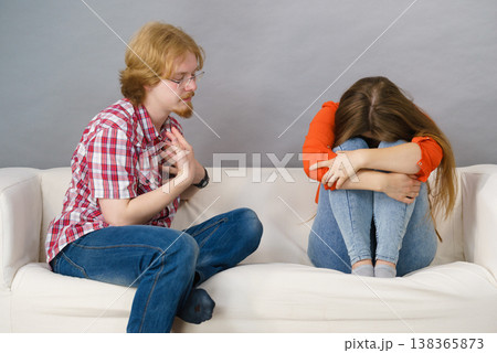 Woman and man after argue on sofa 138365873