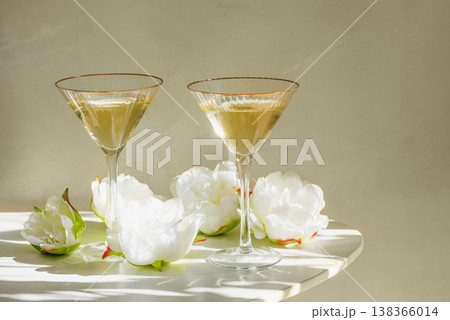 Champagne Glasses with White Peonies. Birthday or Wedding Celebration Arrangement. 138366014