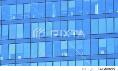 Modern office building with glass facade background. Transparent glass wall of office building. Modern office building with glass facade background. Transparent glass wall of office building. 138366099