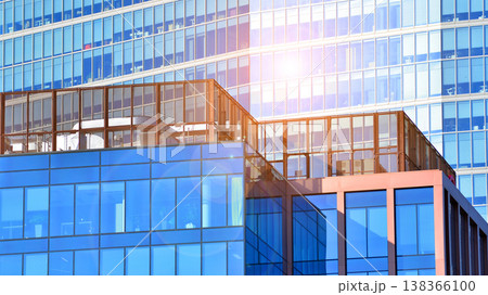 Modern office building with glass facade background. Transparent glass wall of office building. 138366100
