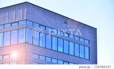 Modern office building with glass facade background. Transparent glass wall of office building. Modern office building with glass facade background. Transparent glass wall of office building. 138366107