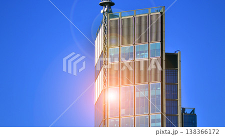 The glass exterior wall of the skyscrapers in the financial center. Tall glass skyscrapers in the city center.  138366172