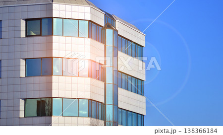 The glass exterior wall of the skyscrapers in the financial center. Tall glass skyscrapers in the city center.  138366184