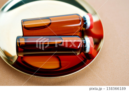 Amber glass vials holding pharmaceutical liquid for research 138366189