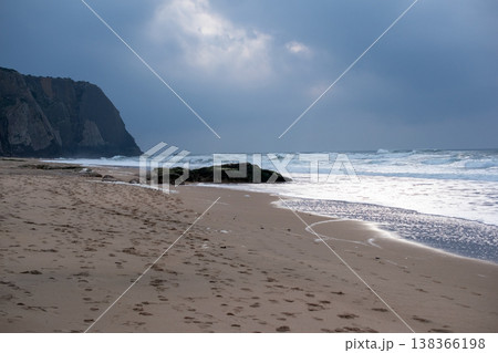 Ocean Waves Colliding with Rocks on Beach Below Cliff Ocean Waves Colliding with Rocks on Beach Below Cliff 138366198