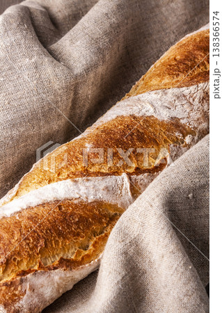 Freshly baked french baguette in on wooden background. High quality photo 138366574