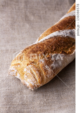 Freshly baked french baguette in on wooden background. High quality photo 138366578