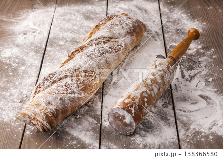 Freshly baked french baguette in on wooden background. High quality photo 138366580
