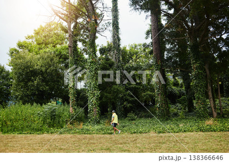 Senior man, exercise walk and forest in profile, adventure and outdoor for wellness in retirement. Mature person, fitness or workout for health, hiking or freedom in woods, countryside or nature park 138366646