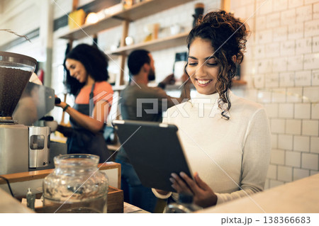 Happy woman, tablet and small business at cafe in management, network or ownership at coffee shop. Female person, entrepreneur or restaurant owner smile with technology, team and barista in store Happy woman, tablet and small business at cafe in management, network or ownership at coffee shop. Female person, entrepreneur or restaurant owner smile with technology, team and barista in store 138366683