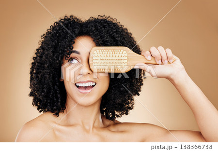 Hair, beauty and woman with afro brush for style isolated in a studio brown background for wellness and skincare. Comb, natural and young person with cosmetic aesthetic in Brazil hairdresser 138366738