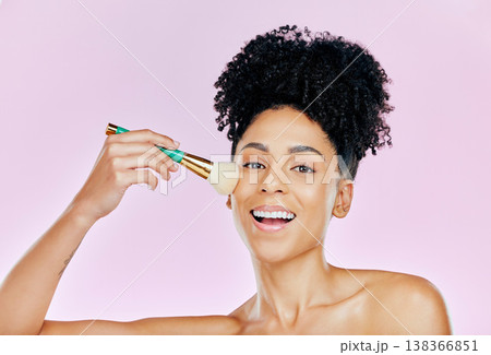 Woman, smile and brush for makeup in studio on pink background in mockup for portrait, cosmetic or beauty. African, person and happiness on face for product, foundation or confidence of glowing skin 138366851
