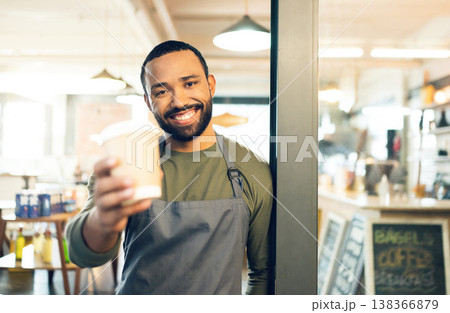 Portrait, happy man or barista with smile for coffee cup in hand for customer. African, person or employee of small business with order of cappuccino, latte or drink in store, cafe or shop for offer 138366879