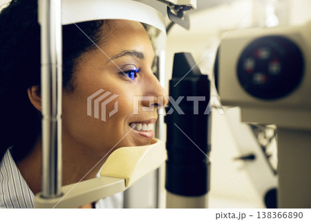 Woman, eye exam and optometry for vision, medical and healthcare consultation or glaucoma check. Happy client with laser technology, blue light or machine for scanning eyes and ophthalmology test Woman, eye exam and optometry for vision, medical and healthcare consultation or glaucoma check. Happy client with laser technology, blue light or machine for scanning eyes and ophthalmology test 138366890