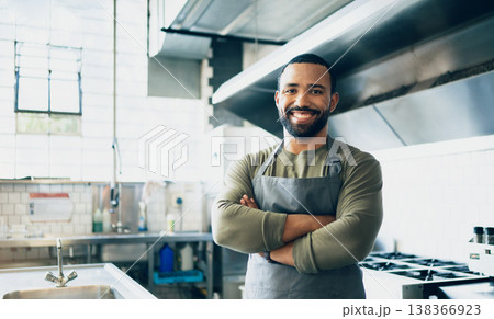 Happy man, chef and small business owner at restaurant for hospitality service, cooking or food in kitchen. Portrait of male person, employee or waiter smile in confidence for professional culinary Happy man, chef and small business owner at restaurant for hospitality service, cooking or food in kitchen. Portrait of male person, employee or waiter smile in confidence for professional culinary 138366923