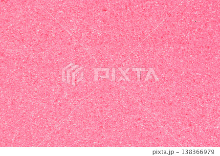Macro shot of a pink foam sponge with a fine porous structure and dense cells. The soft pastel texture creates an organic pattern resembling delicate coral Macro shot of a pink foam sponge with a fine porous structure and dense cells. The soft pastel texture creates an organic pattern resembling delicate coral 138366979