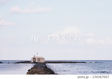 Iconic seaside chapel: the small church of Agios Nikolaos standing on a pier in Georgioupoli, Crete 138367087