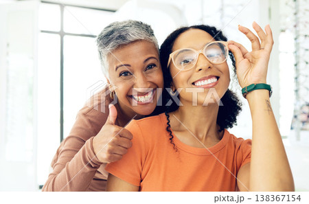 Optometrist, woman and glasses with thumbs up for medical success, frame choice and happy customer service in store. Professional eye care doctor and client in portrait with like, yes and support Optometrist, woman and glasses with thumbs up for medical success, frame choice and happy customer service in store. Professional eye care doctor and client in portrait with like, yes and support 138367154