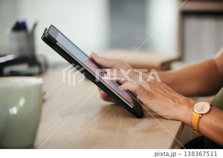 Tablet, hands and closeup of business woman in office doing research and reading information on internet. Online, career and female designer working on project with digital technology in workplace. 138367511
