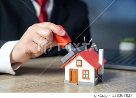 An official stamps a house confirming property registration. Transaction approval and commissioning. Legal validation, documentation, ownership rights ensure compliance and secure Real estate deals An official stamps a house confirming property registration. Transaction approval and commissioning. Legal validation, documentation, ownership rights ensure compliance and secure Real estate deals 138367827