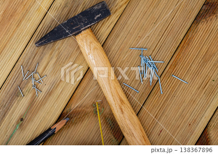 Hand hammer for building works on wooden table Hand hammer for building works on wooden table 138367896
