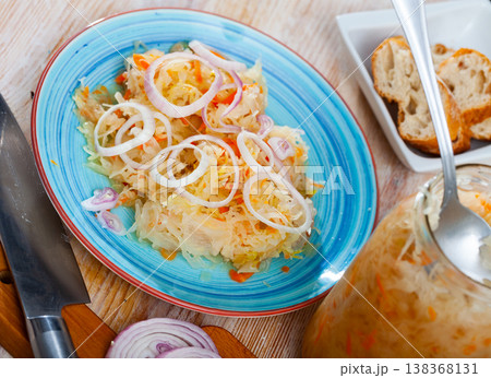 Plate with appetizing sauerkraut, carrots and onion.  138368131