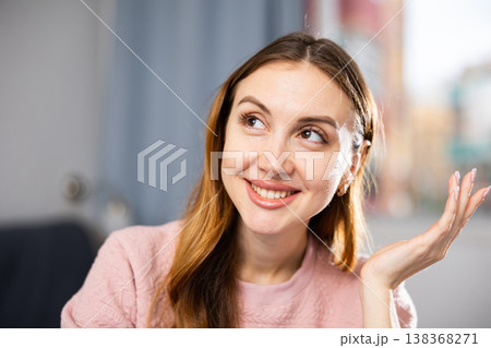 Close-up portrait of a positive girl at the table in room 138368271