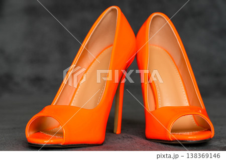 Bright orange high heel shoes glossy patent leather elegant fashion footwear modern style 138369146