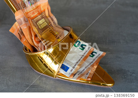 Sexy gold slip on high heel with euro banknotes inside luxury fashion and wealth concept shoe 138369150