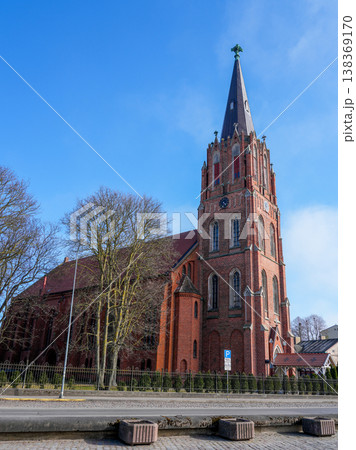 Liepaja St Annes Lutheran Church red brick tower and historic architecture under blue sky Latvia 138369170