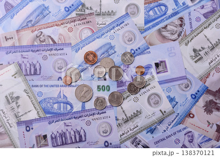 United Arab Emirates cash, dirhams and coins for exchange and financial transactions. UAE currency 138370121