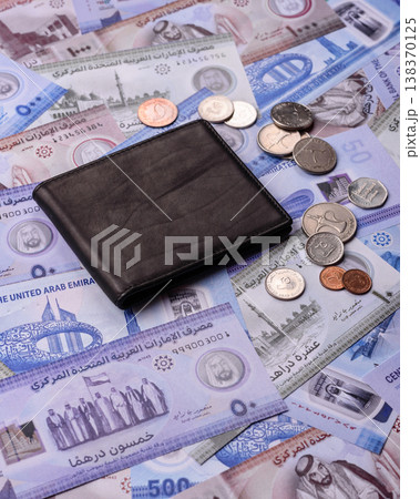 United Arab Emirates cash, dirhams and coins for exchange and financial transactions. UAE currency United Arab Emirates cash, dirhams and coins for exchange and financial transactions. UAE currency 138370125