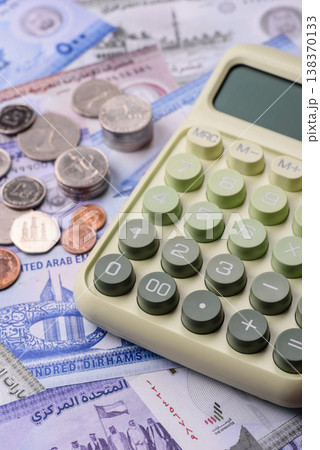 United Arab Emirates cash, dirhams and coins for exchange and financial transactions. UAE currency United Arab Emirates cash, dirhams and coins for exchange and financial transactions. UAE currency 138370133