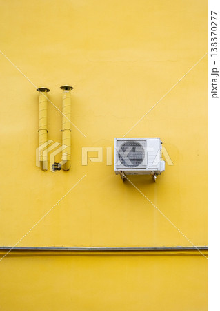 air conditioning on facade of building, air cooling in hot weather. air conditioning on facade of building, air cooling in hot weather. 138370277