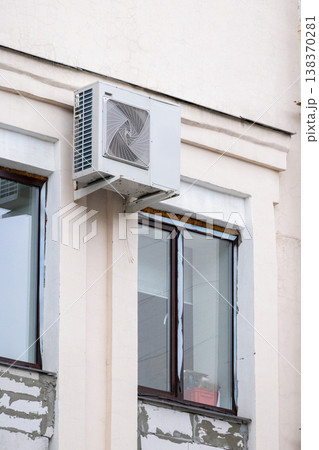 air conditioning on facade of building, air cooling in hot weather.  138370281