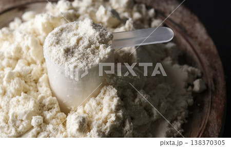Scoop with whey protein powder Scoop with whey protein powder 138370305