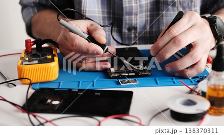 Master Fixing Broken Connector On Smartphone Board Master Fixing Broken Connector On Smartphone Board 138370311